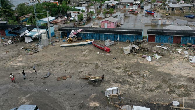 In an aerial view, people in a fishing village recover after Hurricane Beryl passed through the area on July 04, 2024, in Old Harbor, Jamaica. Hurricane Beryl, now a Category 3 storm, continues toward Mexico after passing through Caribbean islands, including Jamaica.