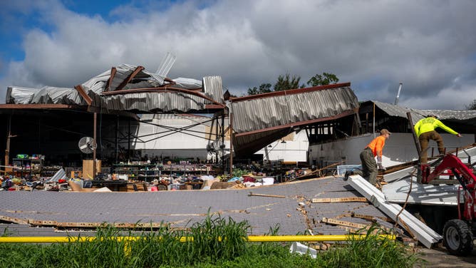 People assess wreckage after Hurricane Francine swept through the area on September 12, 2024 in Houma, Louisiana. Hurricane Francine was upgraded to a Category 2 hurricane when it made landfall yesterday afternoon along the Louisiana coast. Francine brought upward wind speeds of 90mph, flooding, rolling blackouts and widespread damage along the coast. (Photo by Brandon Bell/Getty Images)