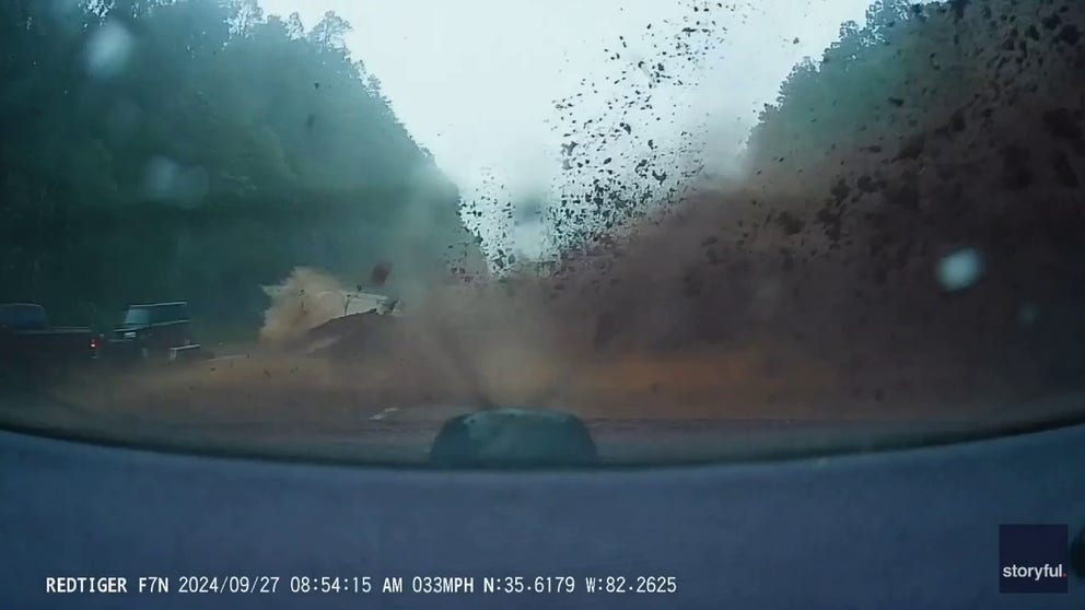 Dashcam footage shot on Friday morning shows the moment a couple barely escaped a mudslide that came crashing onto an interstate in North Carolina’s Blue Ridge Mountains. (Courtesy: Alan Keffer via Storyful)